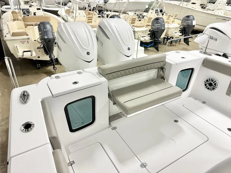 Slide: The Image of 2025 Sportsman Open 302 Center Console boat with dual engines and spacious seating. - 13