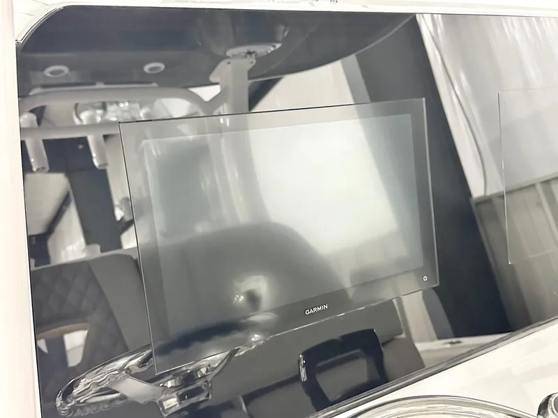 Slide: The Image of 2025 Sportsman Open 302 Center Console with Garmin display screen. - 3