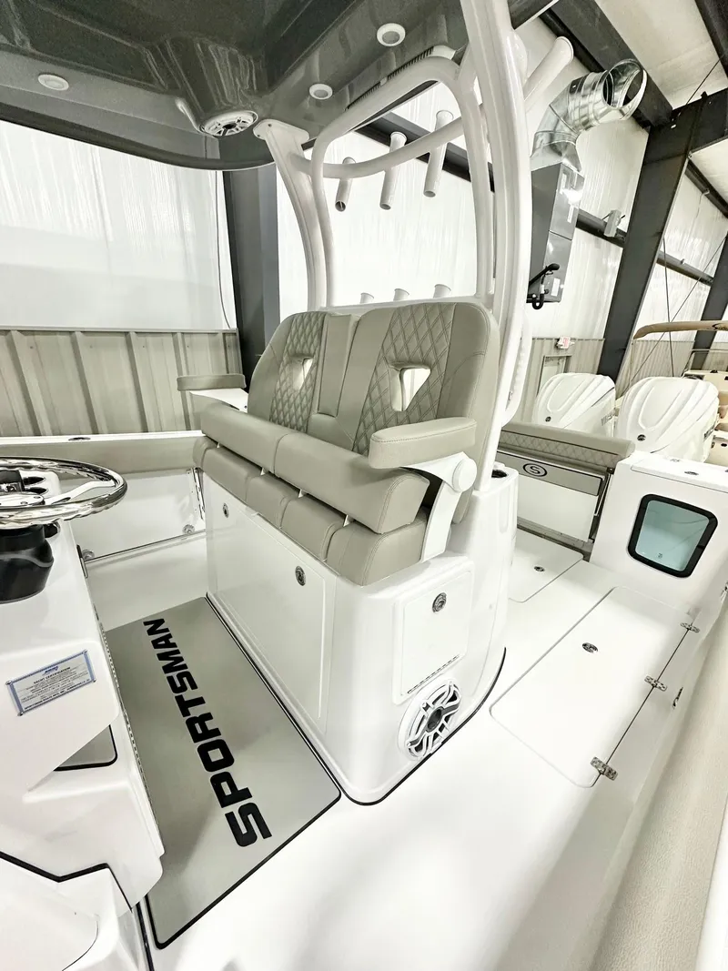 Slide: The Image of 2025 Sportsman Open 302 Center Console boat interior with cushioned seating and modern design. - 4