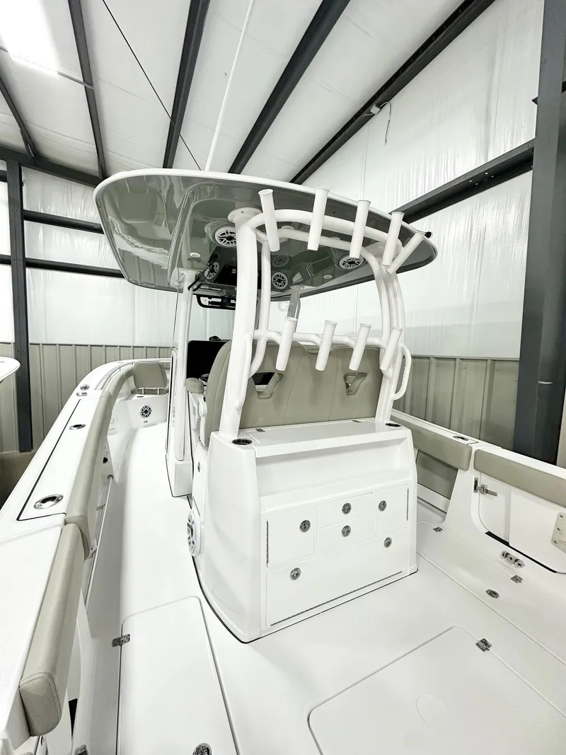 Slide: The Image of 2025 Sportsman Open 302 Center Console boat in indoor storage facility. - 5