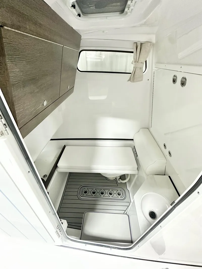 Slide: The Image of 2025 Sportsman Open 302 Center Console cabin interior with modern amenities and sleek design. - 6