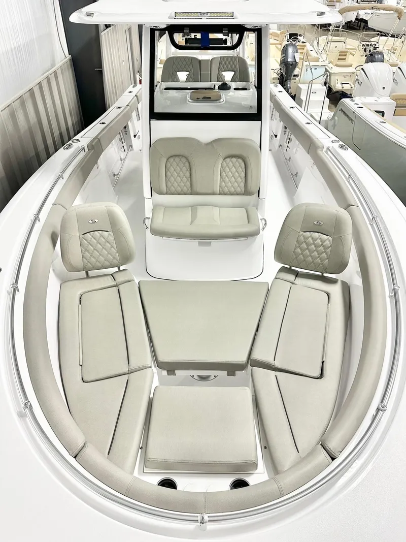 Slide: The Image of 2025 Sportsman Open 302 Center Console boat with spacious seating and modern design. - 8