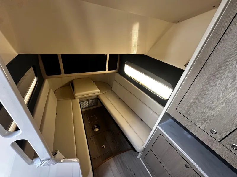 Slide: The Image of 2025 Scout 400 LXF cabin interior with modern seating and cabinetry. - 29