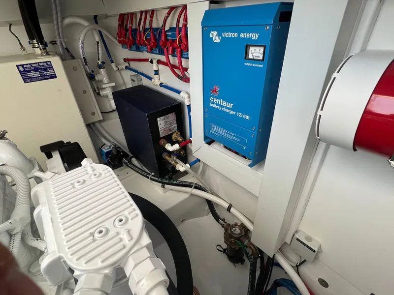Slide: The Image of Engine room of 2025 Henriques 35 Express Hardtop with Victron Energy battery charger. - 29