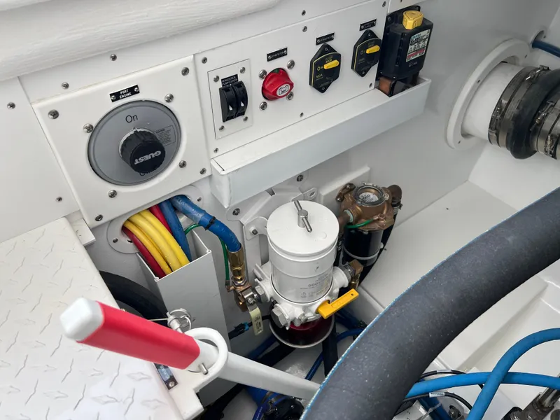 Slide: The Image of Engine control panel of 2025 Henriques 35 Express Hardtop boat, featuring switches and wiring. - 30