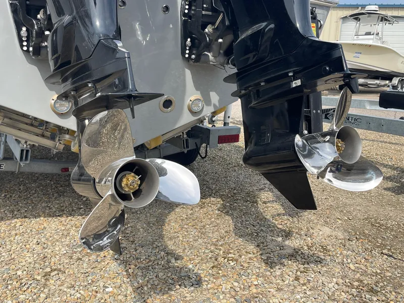 Slide: The Image of 2025 Sea Pro 262 Offshore boat propellers on gravel surface. - 14