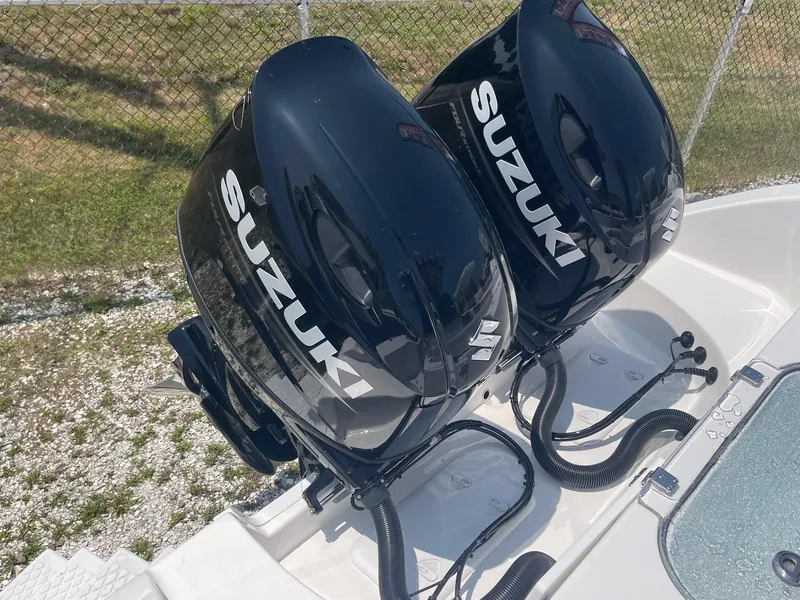 Slide: The Image of Twin Suzuki outboard motors on a 2025 Sea Pro 262 Offshore boat. - 15