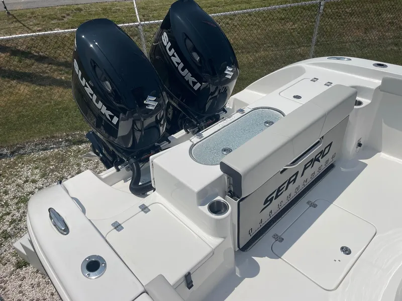 Slide: The Image of 2025 Sea Pro 262 Offshore boat with dual Suzuki outboard engines, rear deck view. - 16