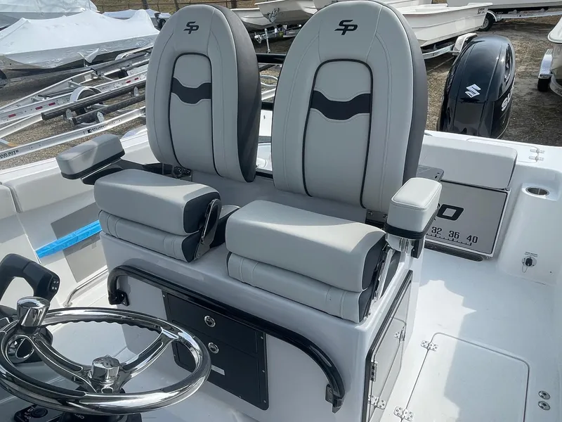 Slide: The Image of 2025 Sea Pro 262 Offshore boat seats and steering wheel, showcasing modern design and comfort. - 18