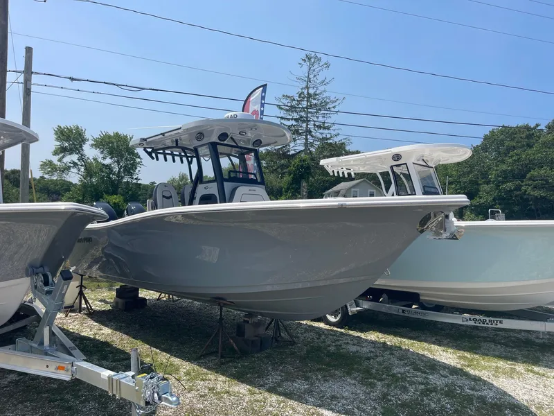 Slide: The Image of 2025 Sea Pro 262 Offshore boat displayed outdoors on a sunny day. - 2