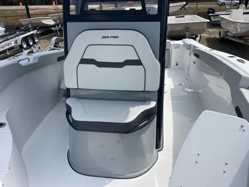 Slide: The Image of 2025 Sea Pro 262 Offshore boat interior with seating and console. - 20