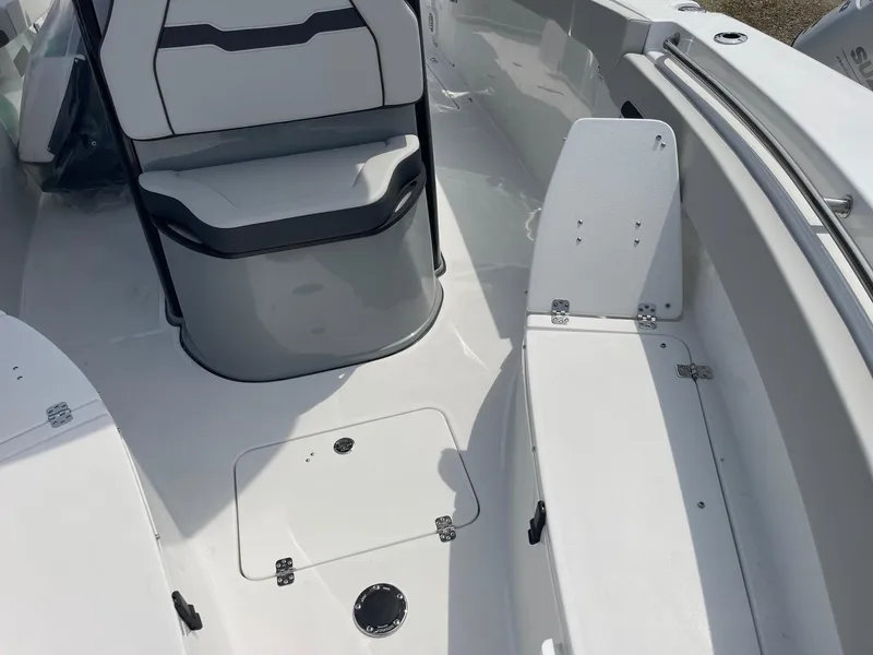Slide: The Image of 2025 Sea Pro 262 Offshore boat interior with seating and storage compartments. - 21