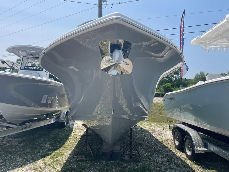 Slide: The Image of 2025 Sea Pro 262 Offshore boat displayed on a trailer, viewed from the front. - 3