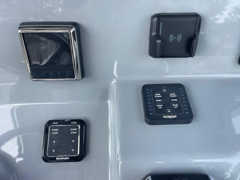 Slide: The Image of Control panel of 2025 Sea Pro 262 Offshore boat with Suzuki and Lectrotab systems. - 31