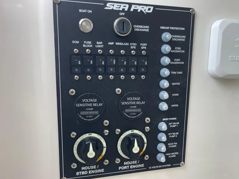 Slide: The Image of Control panel of 2025 Sea Pro 262 Offshore boat with various switches and dials. - 34