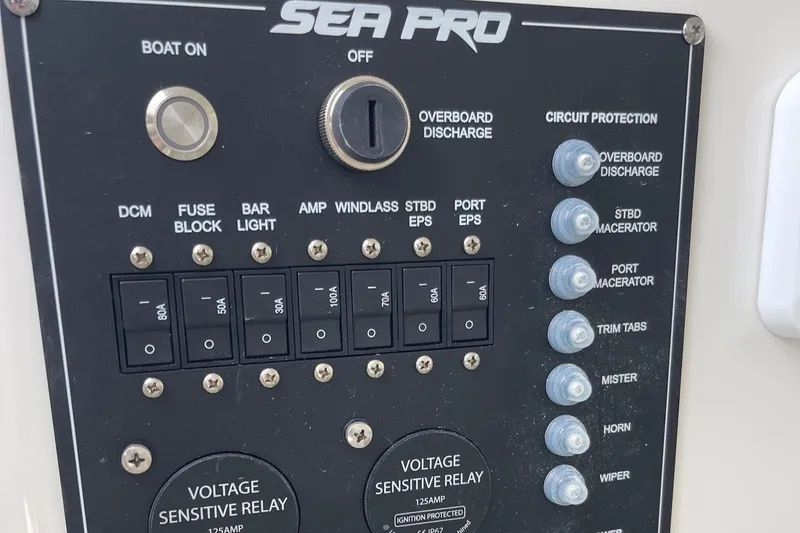 Slide: The Image of Control panel of 2025 Sea Pro 262 Offshore boat with switches and circuit protection. - 36