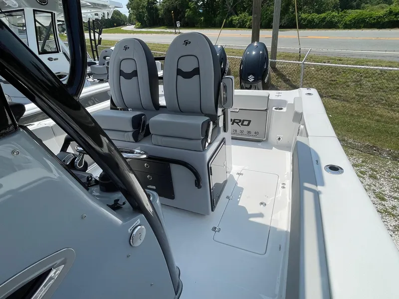 Slide: The Image of 2025 Sea Pro 262 Offshore boat interior with dual seats and console. - 38
