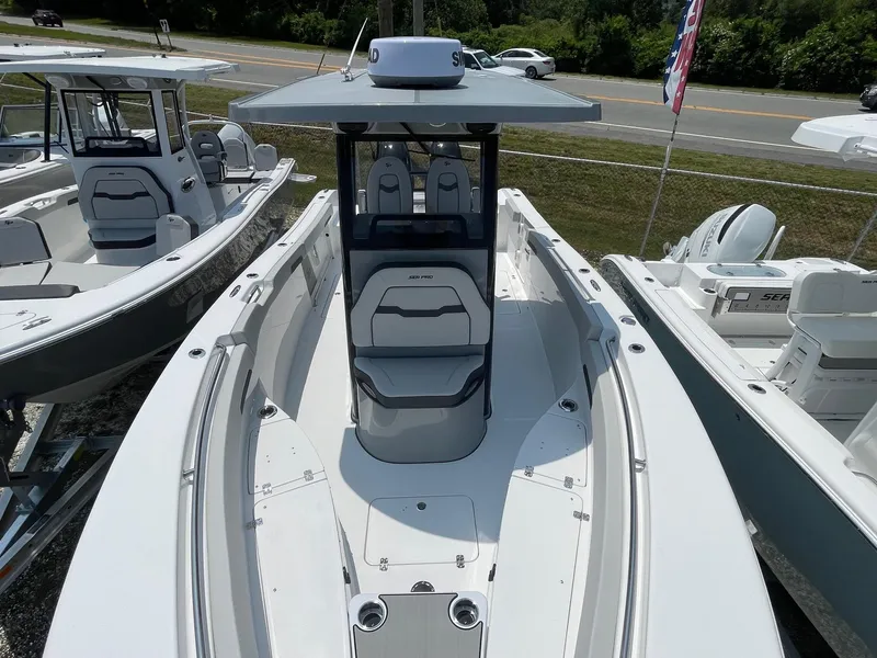 Slide: The Image of 2025 Sea Pro 262 Offshore boat with sleek design, docked alongside similar models. - 40