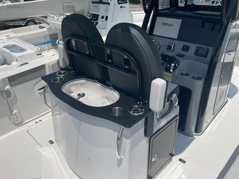 Slide: The Image of 2025 Sea Pro 262 Offshore boat interior with dual seats and control panel. - 43