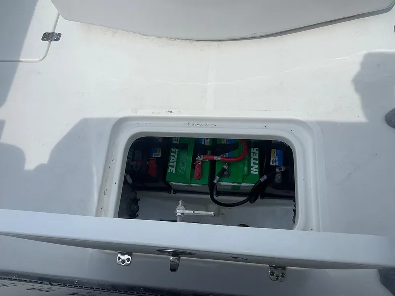 Slide: The Image of Battery compartment of 2025 Sea Pro 262 Offshore boat, featuring Interstate batteries. - 44