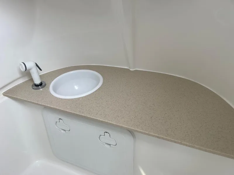 Slide: The Image of Interior sink area of 2025 Sea Pro 262 Offshore boat, featuring a compact design. - 49