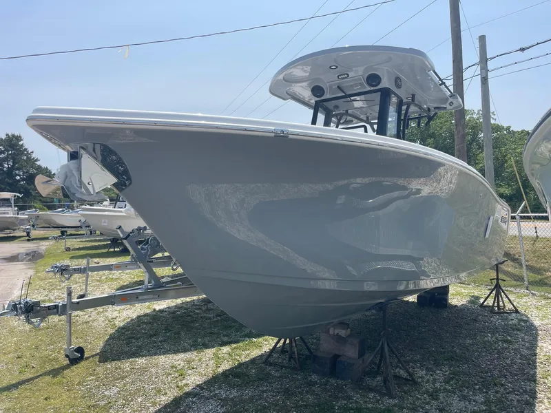 Slide: The Image of 2025 Sea Pro 262 Offshore boat displayed outdoors on stands. - 5