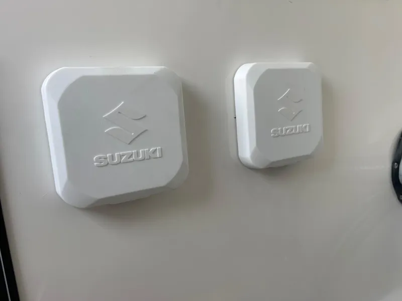 Slide: The Image of Suzuki components on 2025 Sea Pro 262 Offshore boat, featuring sleek white design. - 54