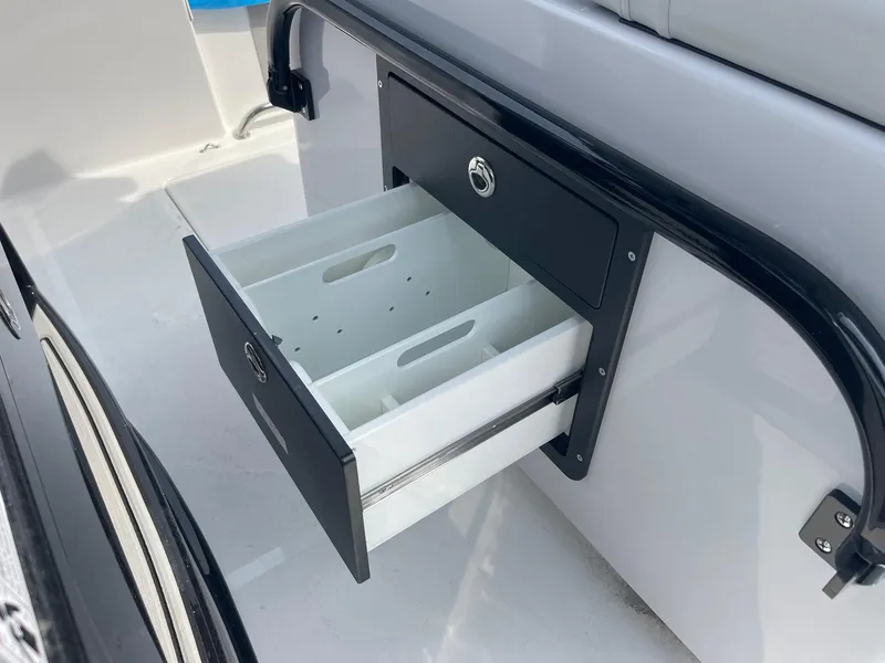 Slide: The Image of 2025 Sea Pro 262 Offshore boat with open storage drawer. - 61