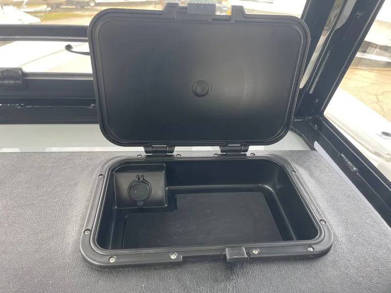 Slide: The Image of Open storage compartment on 2025 Sea Pro 262 Offshore boat. - 62