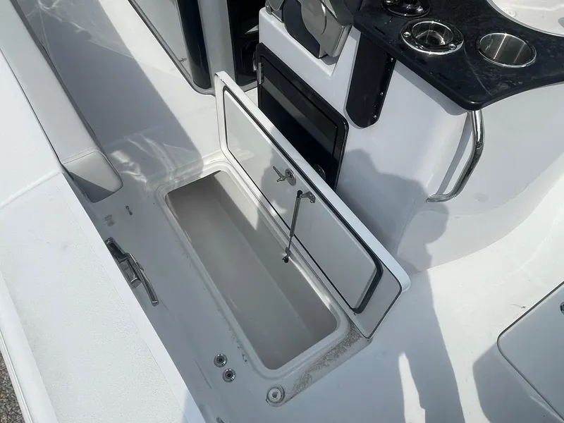 Slide: The Image of 2025 Sea Pro 262 Offshore boat interior with open storage compartment. - 64
