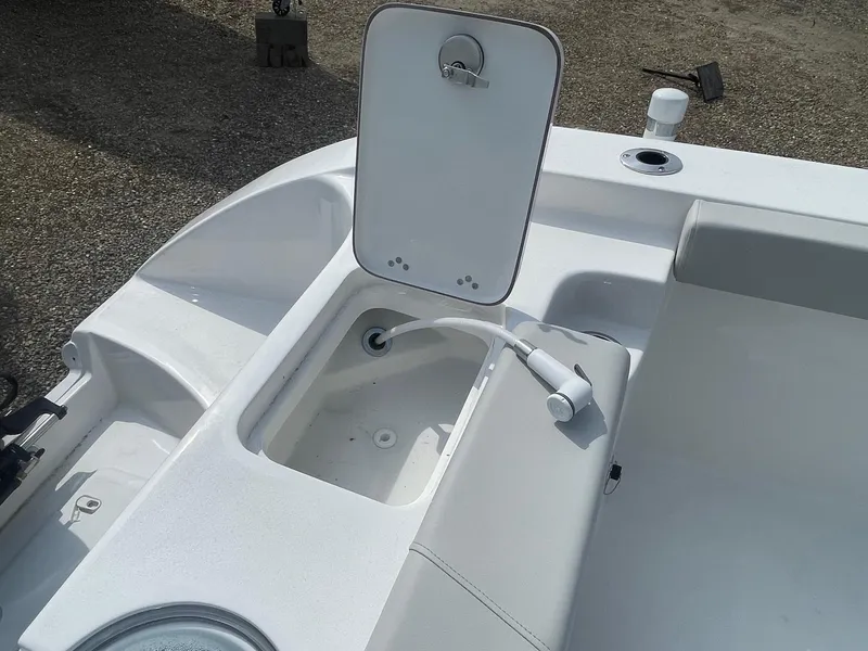 Slide: The Image of 2025 Sea Pro 262 Offshore boat with open storage compartment and faucet. - 65