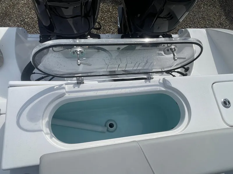 Slide: The Image of 2025 Sea Pro 262 Offshore boat with open livewell and dual engines. - 66