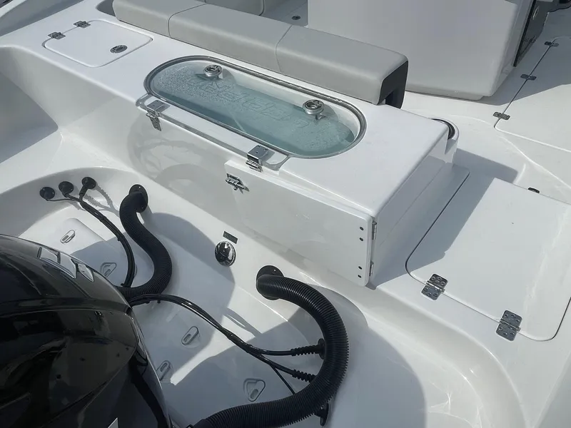 Slide: The Image of 2025 Sea Pro 262 Offshore boat deck with livewell and seating area. - 67