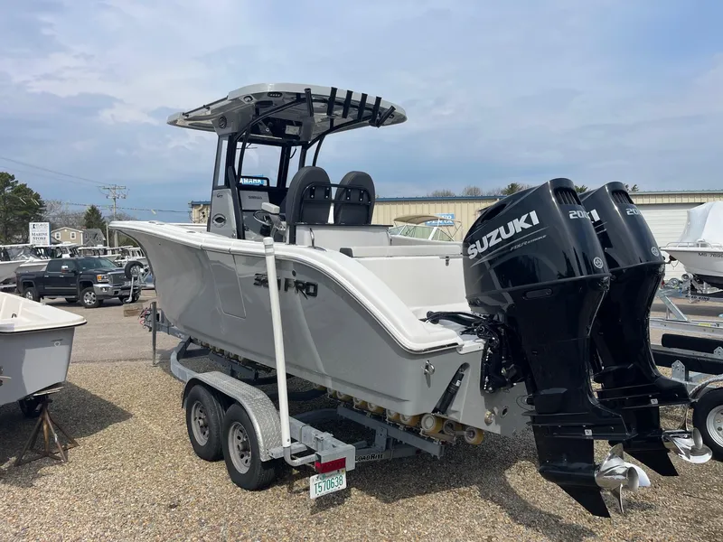 Slide: The Image of 2025 Sea Pro 262 Offshore boat with dual Suzuki engines on a trailer. - 9