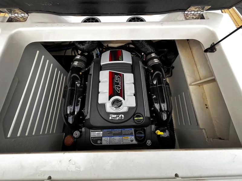 Slide: The Image of Engine compartment of a 2022 Sea Ray SPX 210 boat, featuring a powerful 4.5L engine. - 9