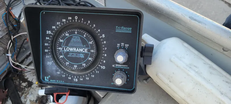 Slide: The Image of Alt text: "1988 Lowe 14' V boat with Lowrance sonar depth finder." - 12