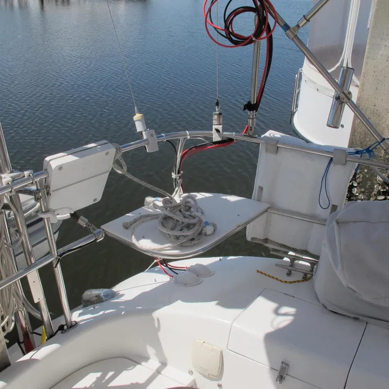 Slide: The Image of Sailboat deck of 1997 Catalina 42 MkII with ropes and equipment, docked on calm water. - 16