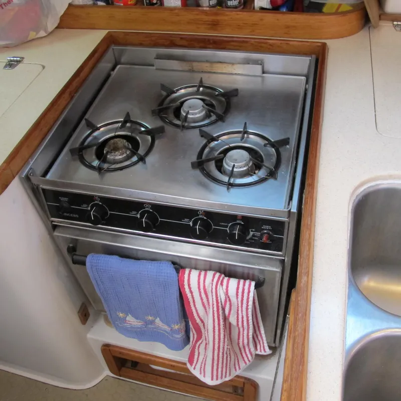 Slide: The Image of Three-burner stove in 1997 Catalina 42 MkII yacht kitchen, with towels hanging. - 23