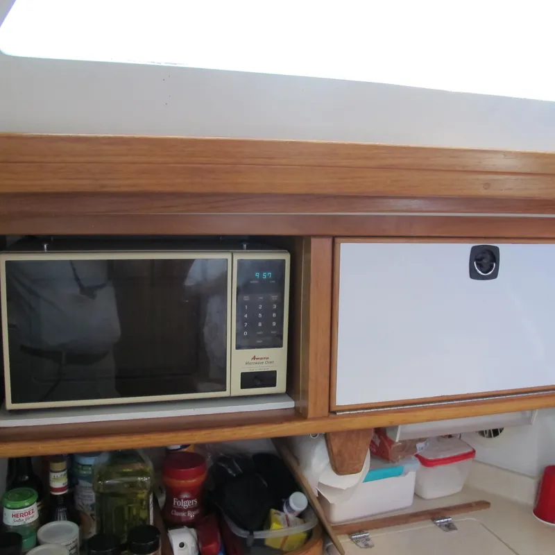 Slide: The Image of Galley of 1997 Catalina 42 MkII with microwave and storage. - 24