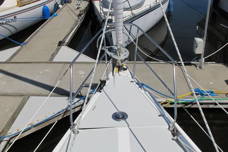 Slide: The Image of Bow of a 1997 Catalina 42 MkII sailboat docked at a marina. - 3
