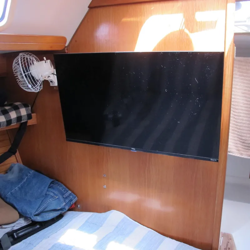 Slide: The Image of Interior of 1997 Catalina 42 MkII yacht with mounted TV and fan. - 34