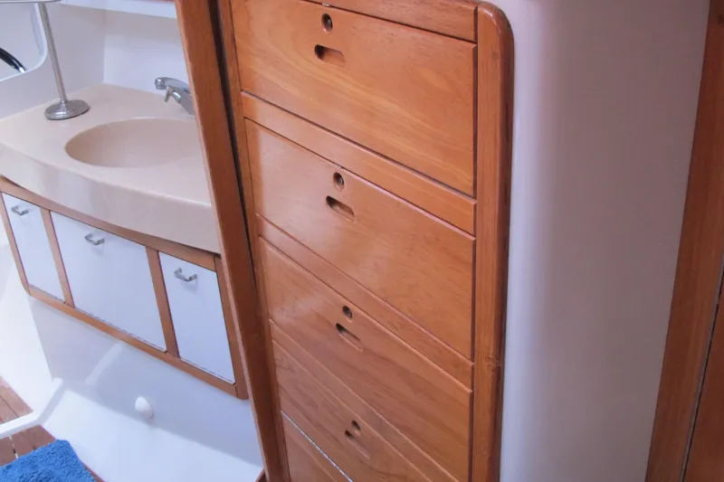 Slide: The Image of Interior of 1997 Catalina 42 MkII yacht with wooden cabinets and bathroom sink. - 39