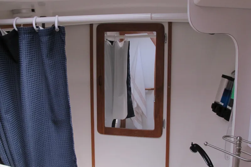 Slide: The Image of Interior of 1997 Catalina 42 MkII sailboat with mirror and blue curtain. - 42