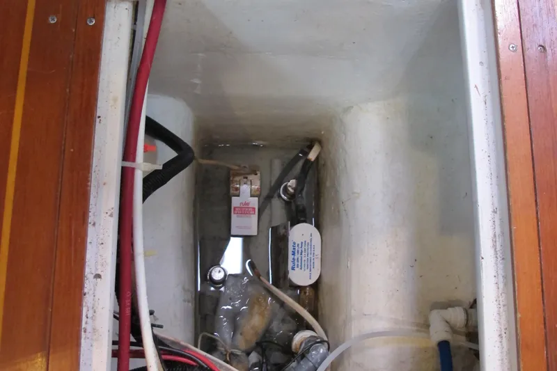 Slide: The Image of Engine compartment of a 1997 Catalina 42 MkII sailboat, showing wiring and components. - 48