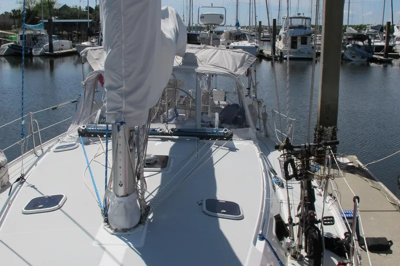 Slide: The Image of Sailboat Catalina 42 MkII, 1997 model, docked in a marina with other boats. - 6