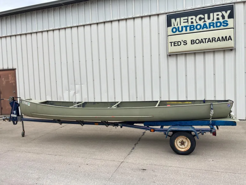 Slide: The Image of 1961 Grumman 19' Square Stern Canoe on trailer outside Ted's Boatarama. - 10