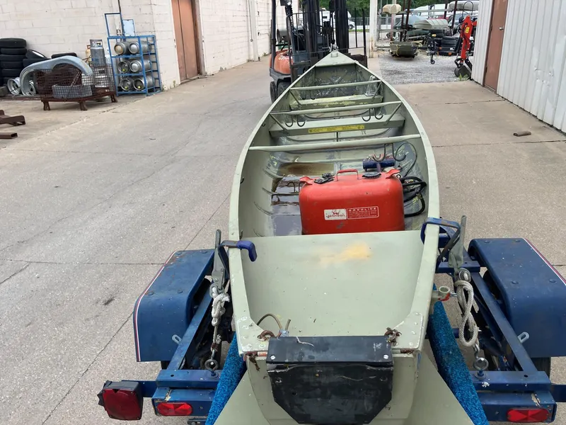 Slide: The Image of 1961 Grumman 19' Square Stern Canoe on trailer, parked in industrial area. - 3