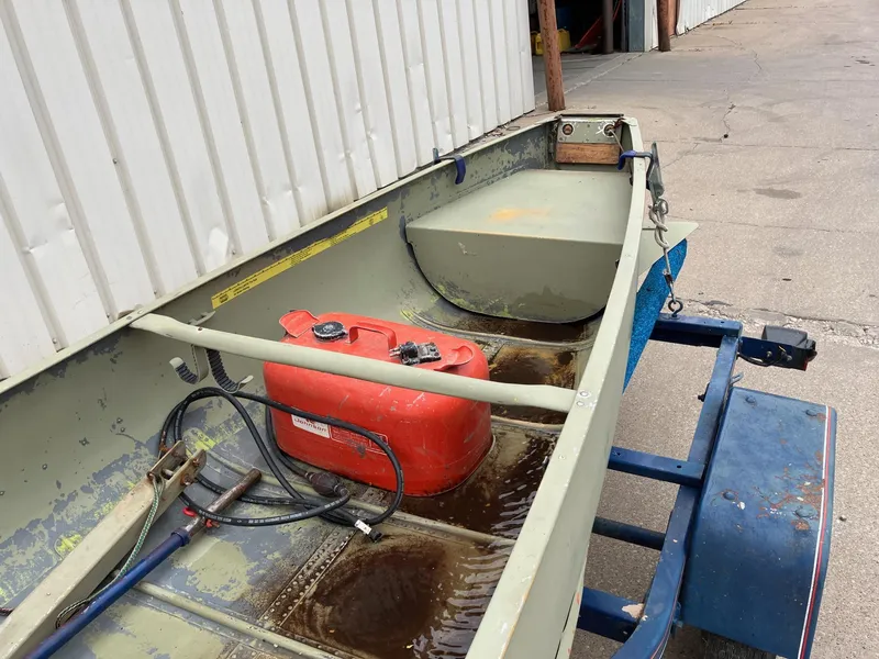 Slide: The Image of 1961 Grumman 19' Square Stern Canoe with red fuel tank on trailer. - 6