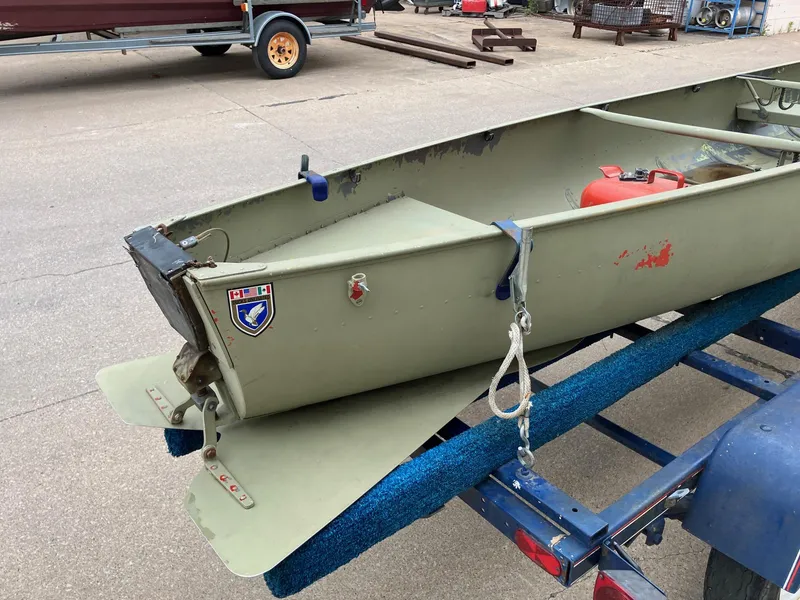 Slide: The Image of 1961 Grumman 19' Square Stern Canoe on trailer, featuring a vintage design. - 8