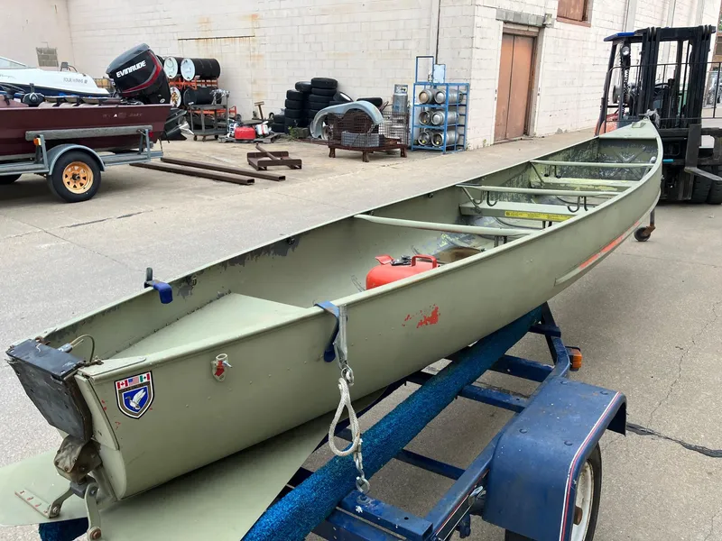 Slide: The Image of 1961 Grumman 19' Square Stern Canoe on trailer, parked in an industrial area. - 9